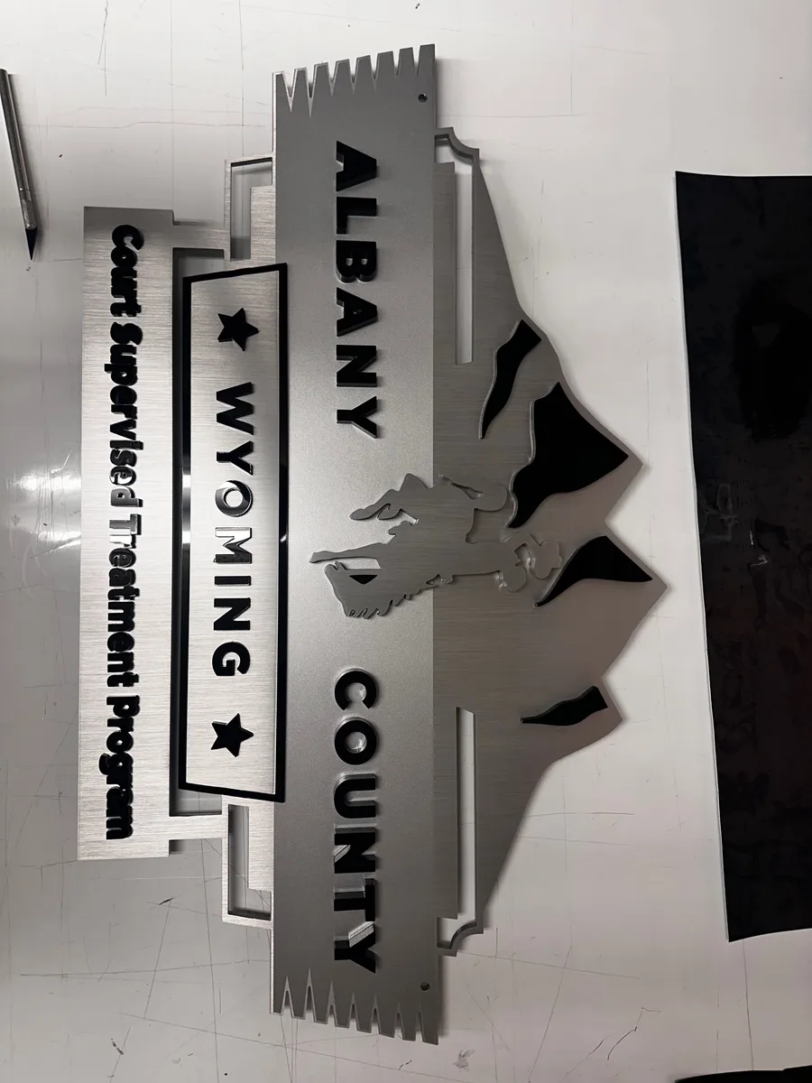 Dimensional lobby sign with brushed metal letters