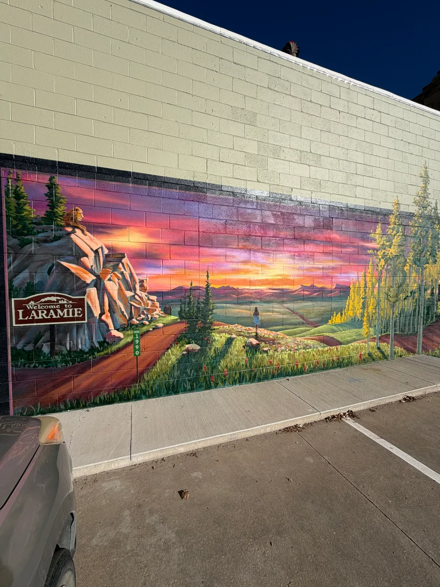Full view of the Welcome to Laramie mural along a downtown block wall